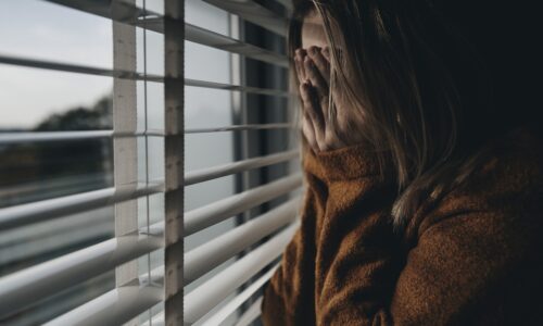 Worried woman cover the face